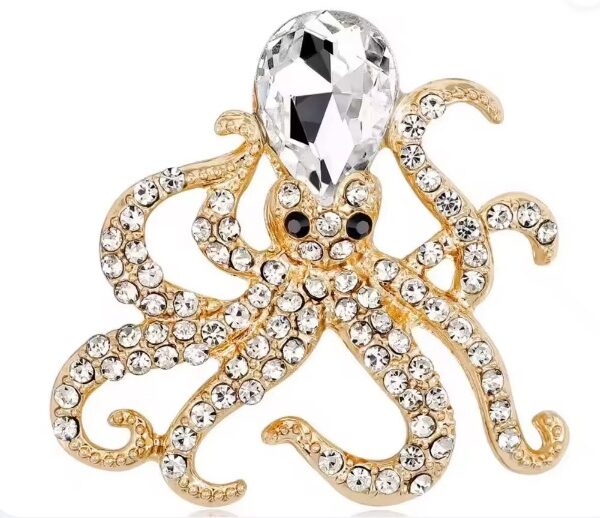 Piccola spilla a forma di polipo in oro con cristallo