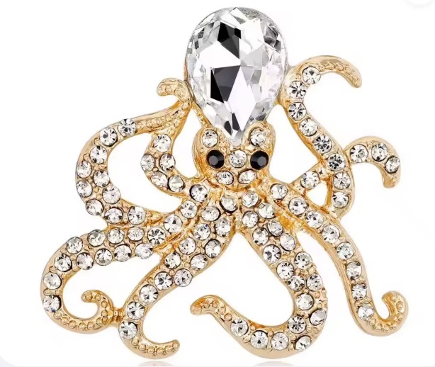 Piccola spilla a forma di polipo in oro con cristallo